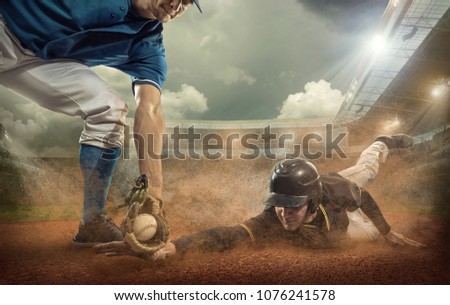 Baseball players in dynamic action under sunset sky on the stadium.