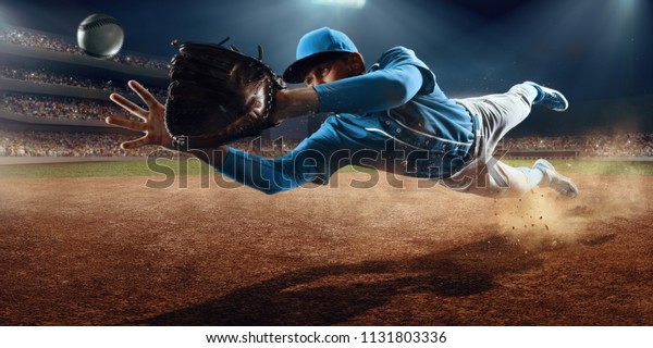 Baseball shortstop catches the ball on\
professional baseball\
stadium