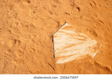 Baseball softball home plate in the infield dirt view from above - Powered by Shutterstock