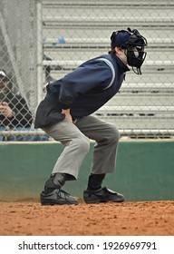 Baseball Or Softball Umpire Calling Balls And Strikes During A Game