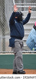 Baseball Or Softball Umpire Calling Balls And Strikes During A Game