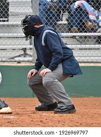 Baseball Or Softball Umpire Calling Balls And Strikes During A Game