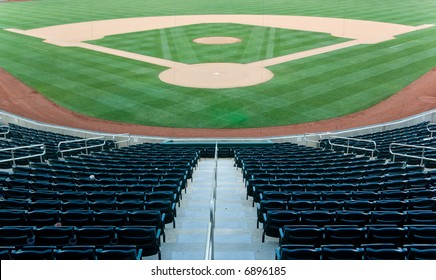 Baseball stadium with seating and a baseball diamond with green grass