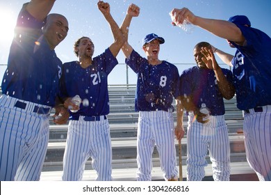 Baseball team celebrating victory and cheering - Powered by Shutterstock