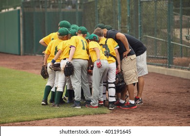 Baseball team in a huddle  - Powered by Shutterstock