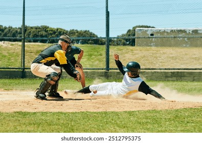 In baseball you need to be up for the challenge. Full length shot of a young baseball player reaching base during a match on the field.