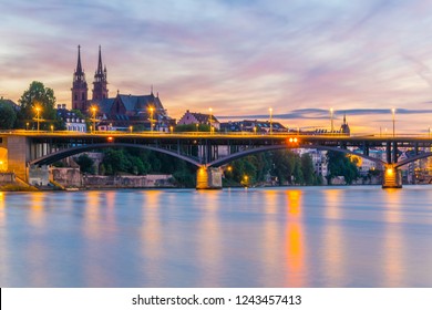 Basel Minster viewed behind the Wettstein Bridge during sunset, Switzerland