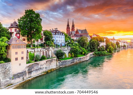 Basel, Switzerland. Old town with red stone Munster cathedral on the Rhine river.