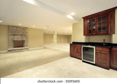 Basement With Bar And Fireplace