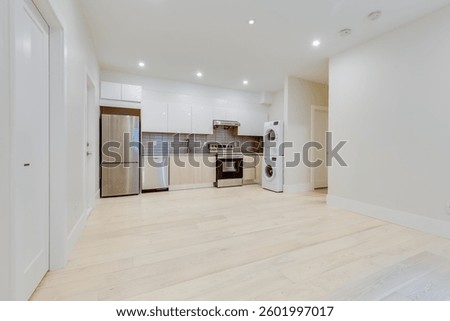 Basement or ground floor simple kitchen with washer and drier