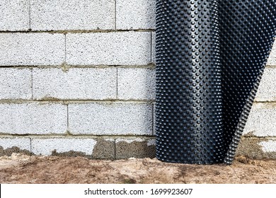 Basement Wall Waterproofing - Installing Dimple Geomembrane