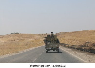 BASHIK FRONTLINE, KURDISTAN, IRAQ - 2015 JULY 25  - Kurdish (peshmerga) Truck Driving Down Road At BASHIK (bashik) Base 25km From ISIS Controlled Mosul. 