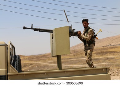 BASHIK FRONTLINE, KURDISTAN, IRAQ - 2015 JULY 25  - Unidentified Kurdish (peshmerga) Fighter In Truck At BASHIK (bashik) Base 25km From ISIS Controlled Mosul. 