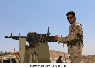 BASHIK FRONTLINE, KURDISTAN, IRAQ - 2015 JULY 25  - Unidentified Kurdish (peshmerga) Fighter In Back Of Truck At BASHIK (bashik) Base 25km From ISIS Controlled Mosul. 