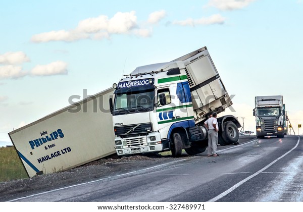 BASHKORTOSTAN, RUSSIA - JULY 12,\
2015: Semi-trailer truck Volvo FH12 crashed at the interurban\
freeway.