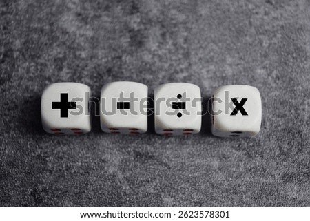 Basic mathematical operation symbols. Plus, minus, multiply and divide symbols on wooden cubes or dice. Basic calculate for business concept