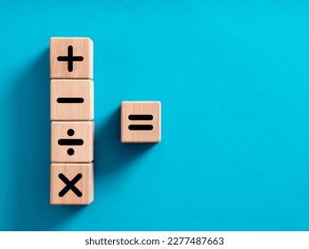 Basic mathematical operations symbols. Plus, minus, multiply, divide and equal symbols on wooden cubes. Mathematic or math education and basic calculations for business concept.