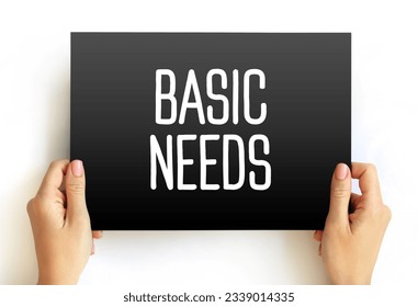 Basic Needs - one of the major approaches to the measurement of absolute poverty in developing countries, text concept on card