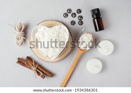 Basic set for home-made natural white eco soy wax candles in glass, wick, perfume. Idea for a hobby, business. Making trendy diy candles without harm to health on white background. 