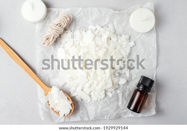 Basic set for home-made natural white eco-friendly\
soy wax candles, wick, perfume. Idea for a hobby, business. Making\
trendy diy candles without harm to health on white background, top\
view