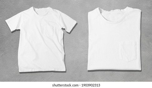 Basic White Tshirt On Grey Concrete Background. Mock Up For Branding T-shirt With Pocket. 