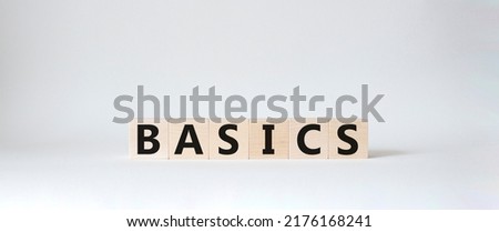 Basics symbol. Concept word Basics on wooden cubes. Beautiful white background. Business and Basics concept. Copy space.