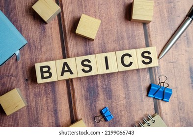 Basics Word Written On Wood Blocks On Wooden Background With Flat Lay View