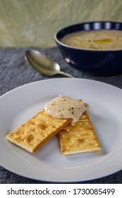 Basil Garlic White Bean Dip On Crackers.