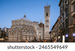 The Basilica di Santa Maria del Fiore and Baptistery San Giovanni day to night transition timelapse. It is the cathedral church (Duomo) of Florence in Italy. Evening illumination. Bell tower and dome