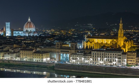 Basilica Santa Croce and Santa Maria del Fiore in Florence at night timelapse - viewed from Piazzale Michelangelo with Arno River. Evening illumination. Aerial top view