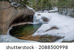 The Basin in Franconia Notch State Park during winter . New Hampshire mountains. USA