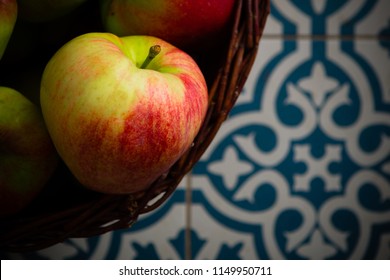 Basket Of Apple On Kitchen Tile Floor, Vignette Frame