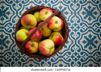 Basket Of Apple On Kitchen Tile Floor, Vignette Frame