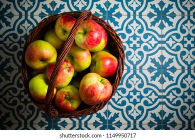 Basket Of Apple On Kitchen Tile Floor, Vignette Frame