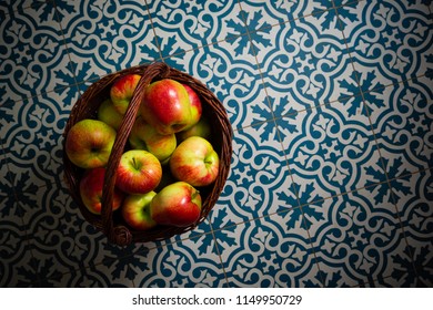 Basket Of Apple On Kitchen Tile Floor, Vignette Frame