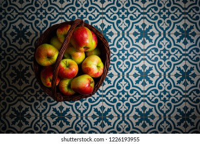 Basket Of Apple On Kitchen Tile Floor, Vignette Frame