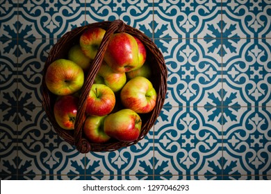 Basket Of Apple On Kitchen Tile Floor, Vignette Frame