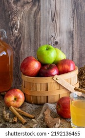 A Basket Of Autumn (fall) Harvest Apples And Apple Cider In An Autumn (fall) Scene