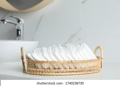 Basket With Baby Diapers On Counter In Bathroom