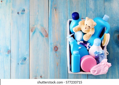 Basket Of Baby Supplies On Blue Background - Baby Time