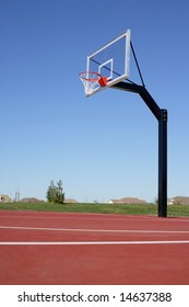 A Basket Ball Hoop On An Out Door Court