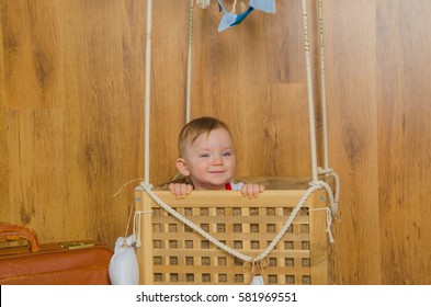 in the basket of the balloon, playing a boy child