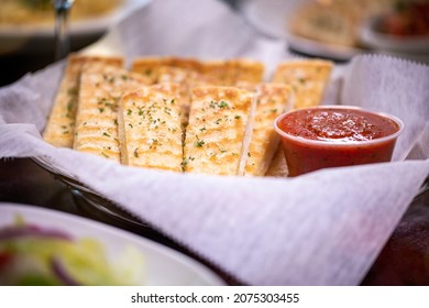 Basket Bowl Fresh Italian Sliced Golden Bread Sticks Garnish Green Parsley Parmesan Cheese Red Side Dipping Marinara Pomodoro Sauce Deli Paper Rustic Dining Wine Glass