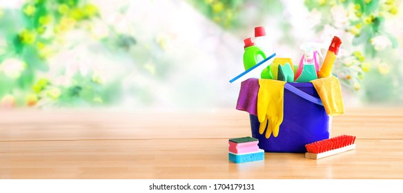 Basket With Cleaning Items On Blurry Spring Background. Washing Set With Copy Space Banner.