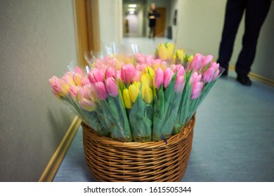Basket with colorful bouquets of tulips on white background - Shutterstock ID 1615505344
