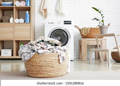 Basket with dirty laundry on floor in bathroom