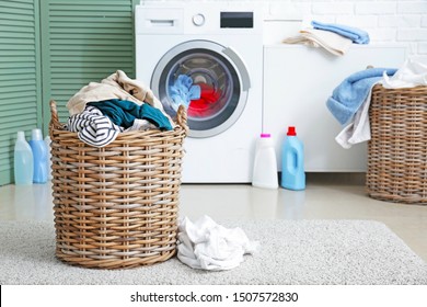 Basket With Dirty Laundry On Floor In Bathroom