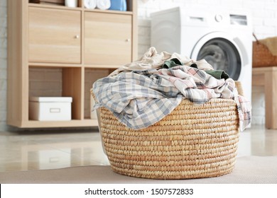 Basket With Dirty Laundry On Floor In Bathroom