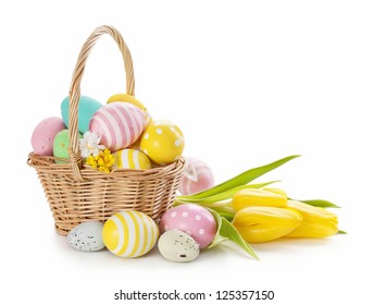 Basket with easter eggs on white background