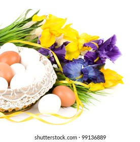 Basket with Easter eggs and spring flowers